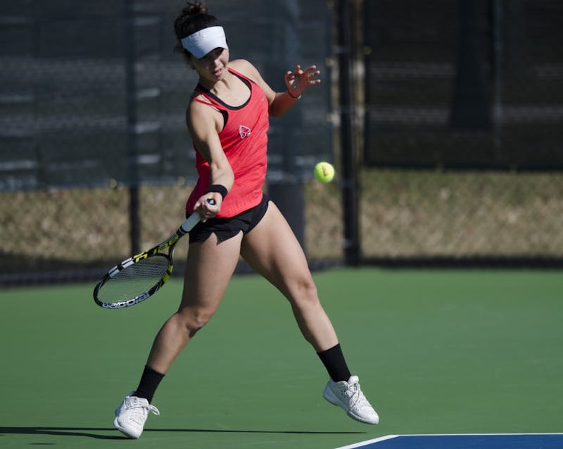 Senior Rosalinda Calderon hits a forehand during her doubles match against IUPUI on Feb. 19. Emma Rogers // DN