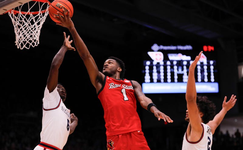 Junior guard Jermahri Hill puts the ball up for two against Dayton University Nov. 13 at Dayton, Ohio. Hill had four personal fouls in the game. Andrew Berger, DN 