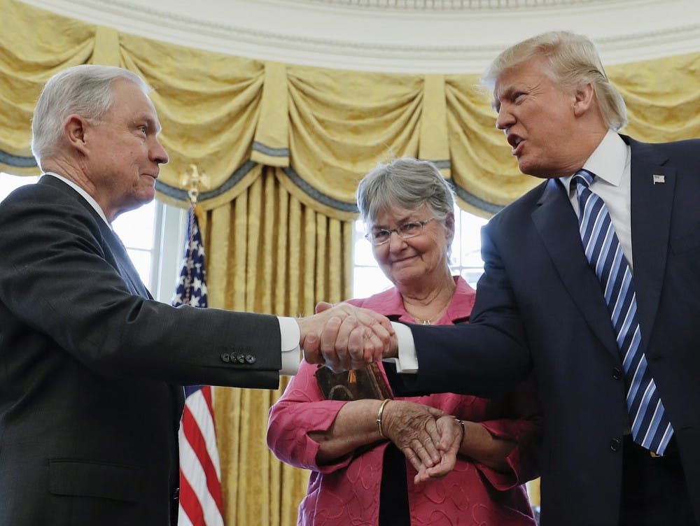 <p>In this Feb. 9, 2017 file photo, President Donald Trump shakes hands with Attorney General Jeff Sessions, accompanied by his wife Mary, after he was sworn-in by Vice President Mike Pence, in the Oval Office of the White House in Washington. On Nov. 7, 2018, Sessions submitted his resignation in letter to Trump. <strong>(AP Photo/Pablo Martinez Monsivais, File)</strong></p>