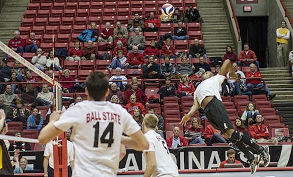 Jamion Hartley sails through the air to slam the ball across the net. Hartley took two kills during the match. DN FILE PHOTO COREY OHLENKAMP
