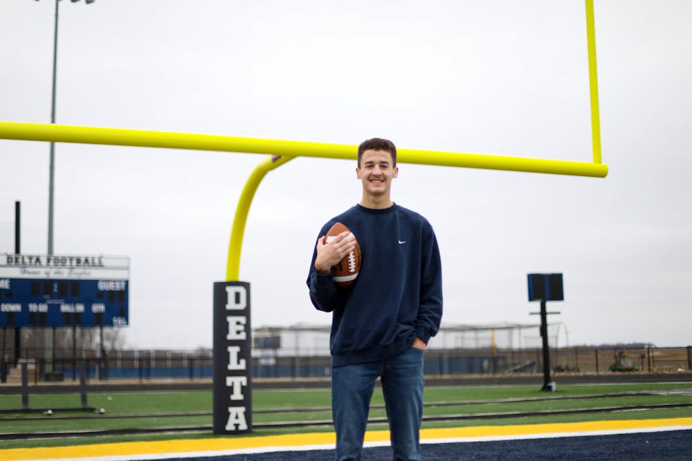 Delta High School senior Caleb Elliot poses on the football field Jan. 21 at Delta High School in Muncie, Ind. The senior was a finalist for the Man of The Year Award. The award, given by the Indianapolis Colts youth program, goes to a high school football player who show’s leadership on and off the field. Jacy Bradley, DN