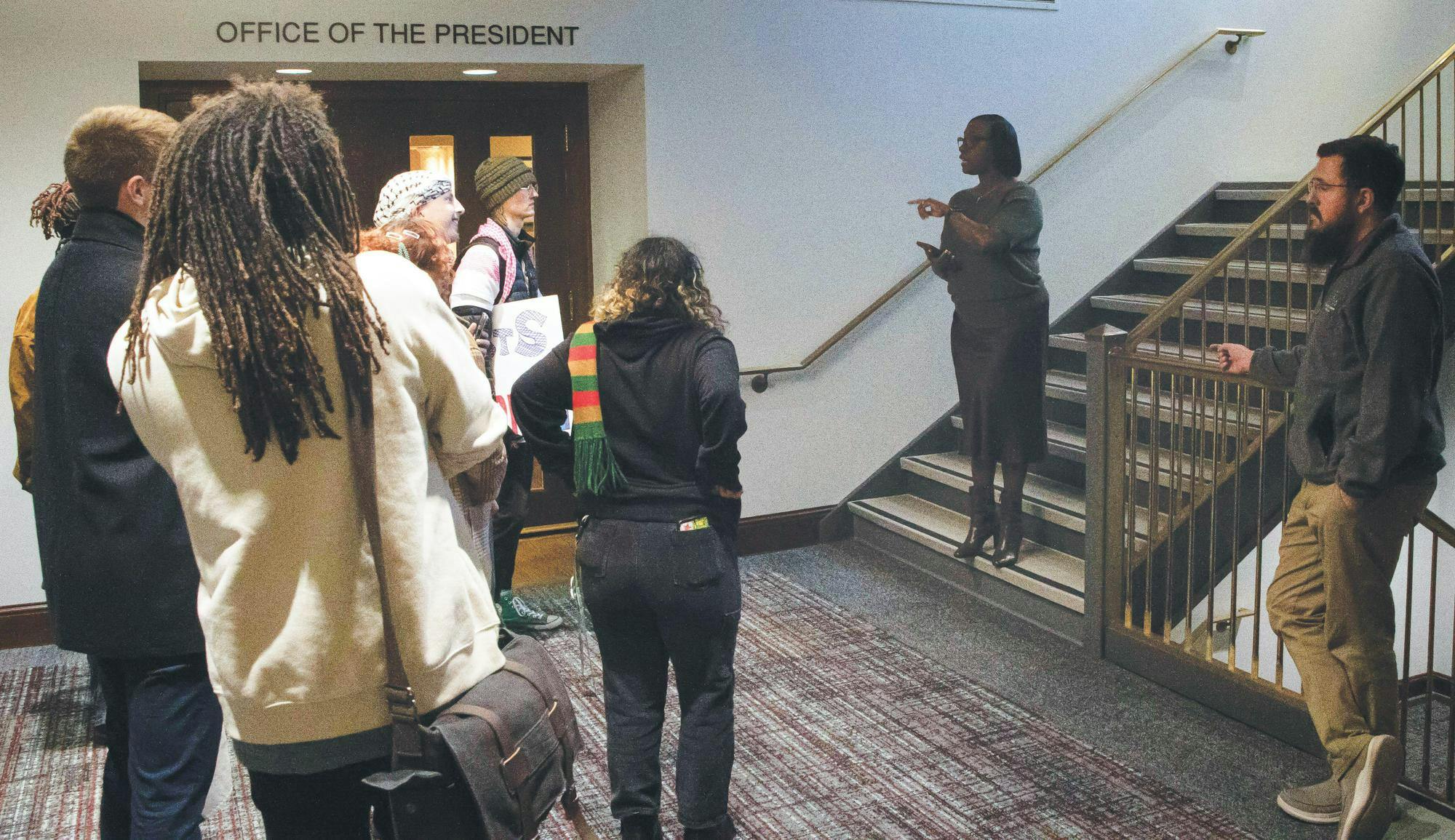 Protesters get stopped by Vice President of Student Affairs Ro-Anne Royer Engle November 2025 in the Frank A. Bracken Administration Building. Will Baker, DN