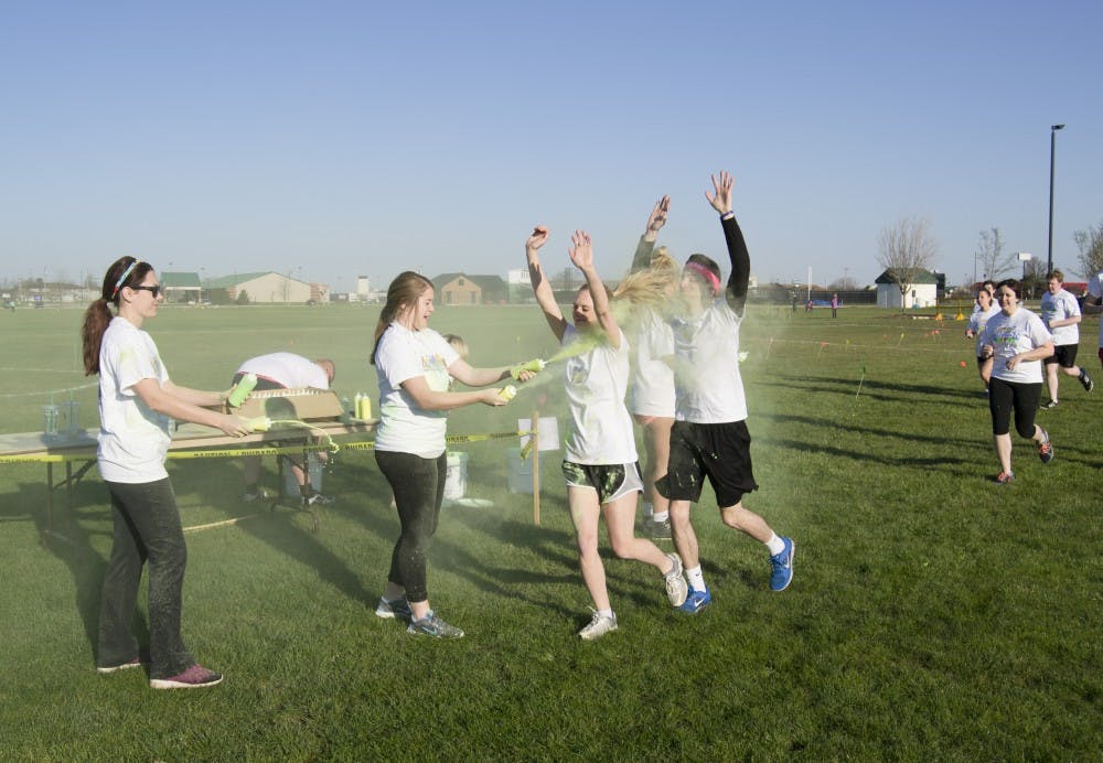 People participated in the 4th annual Chase the Rainbow 5K on April 16 at Bethel Field. Participants were colored with wet and dry paint throughout the course. DN PHOTO CURTIS SILVEY