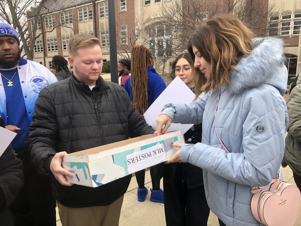 Grabbing signs, members of the Muncie and Ball State University communities prepare for the "MLK March" Jan. 16. This event began at the L.A. Pittenger Student Center and saw the participants march down McKinley Avenue. Zach Gonzalez, DN