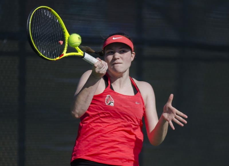 Freshman Rebecca Herrington hits a forehand during her doubles match against IUPUI on Feb. 19. Emma Rogers // DN