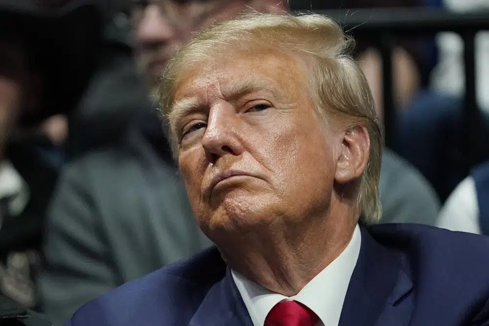 Former President Donald J. Trump watches the NCAA Wrestling Championships, Saturday, March 18, 2023, in Tulsa, Okla. (AP Photo/Sue Ogrocki, File)