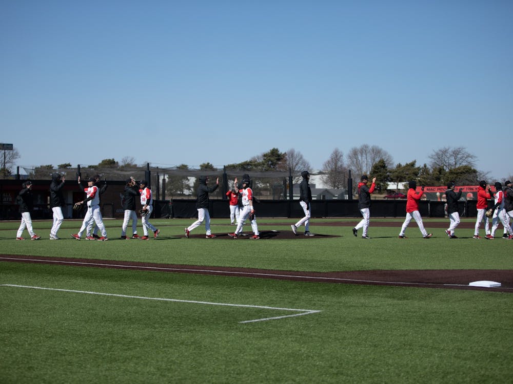Ball State baseball players celebrate their win in the first game of the double header against Eastern Michigan Mar. 13 at First Merchants Ballpark Complex. The Cardinals opened their Mid-American Conference season going winning both games against Eastern Michigan with scores of 2-1 and 6-4. Eli Houser, DN