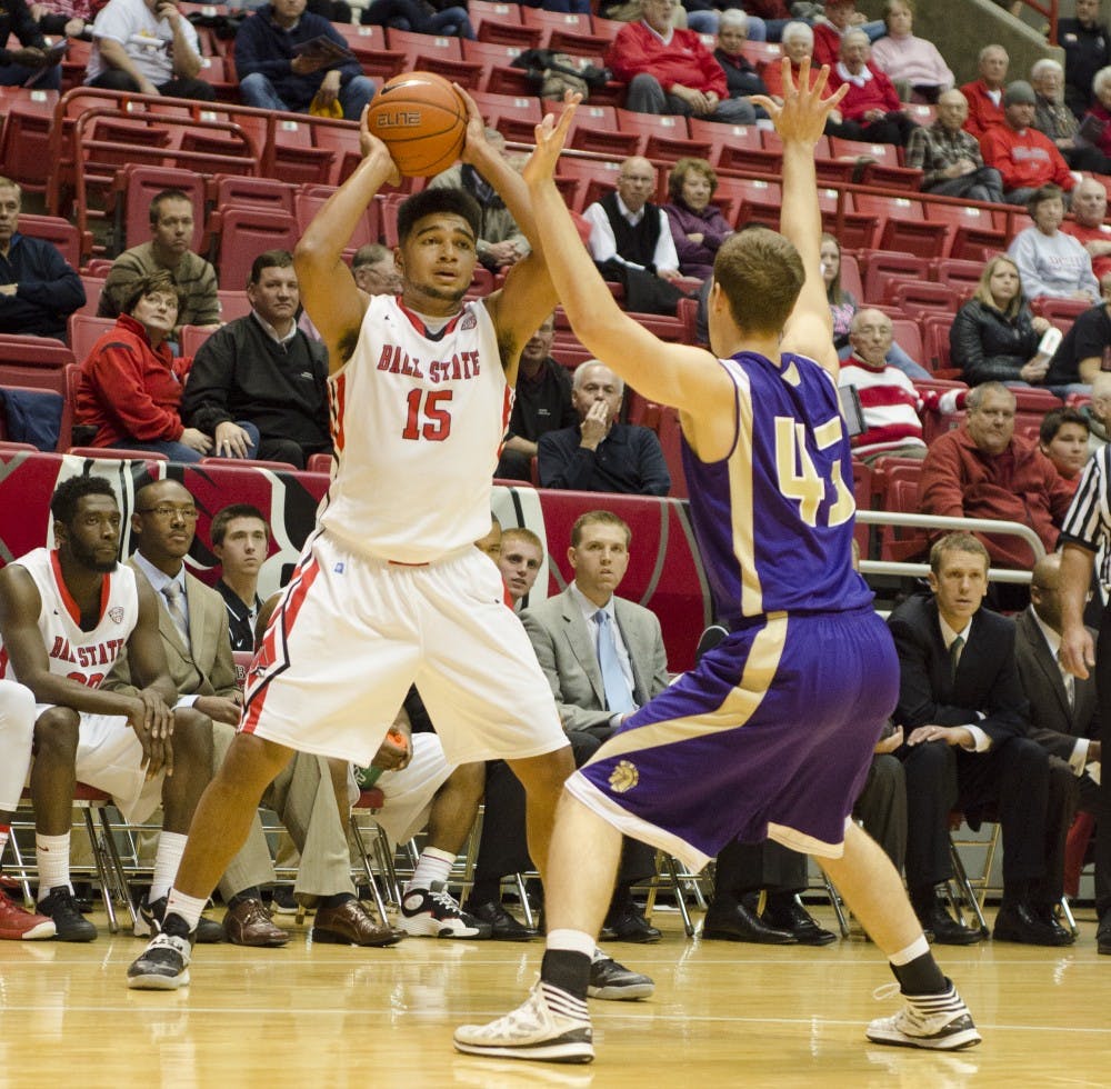 Freshman forward Franko House tries to keep the ball away from a Taylor University player on Nov. 12 at Worthen Arena. DN PHOTO BREANNA DAUGHERTY