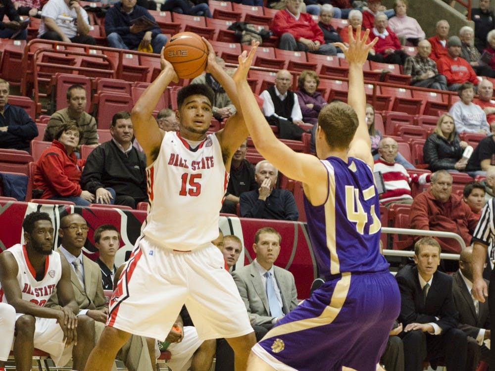 Freshman forward Franko House tries to keep the ball away from a Taylor University player on Nov. 12 at Worthen Arena. DN PHOTO BREANNA DAUGHERTY