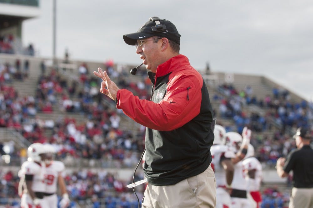 Head coach Pete Lembo talks to the refs during the game against Indiana State on Sept. 13 at Scheumann Stadium DN PHOTO TAYLOR IRBY 