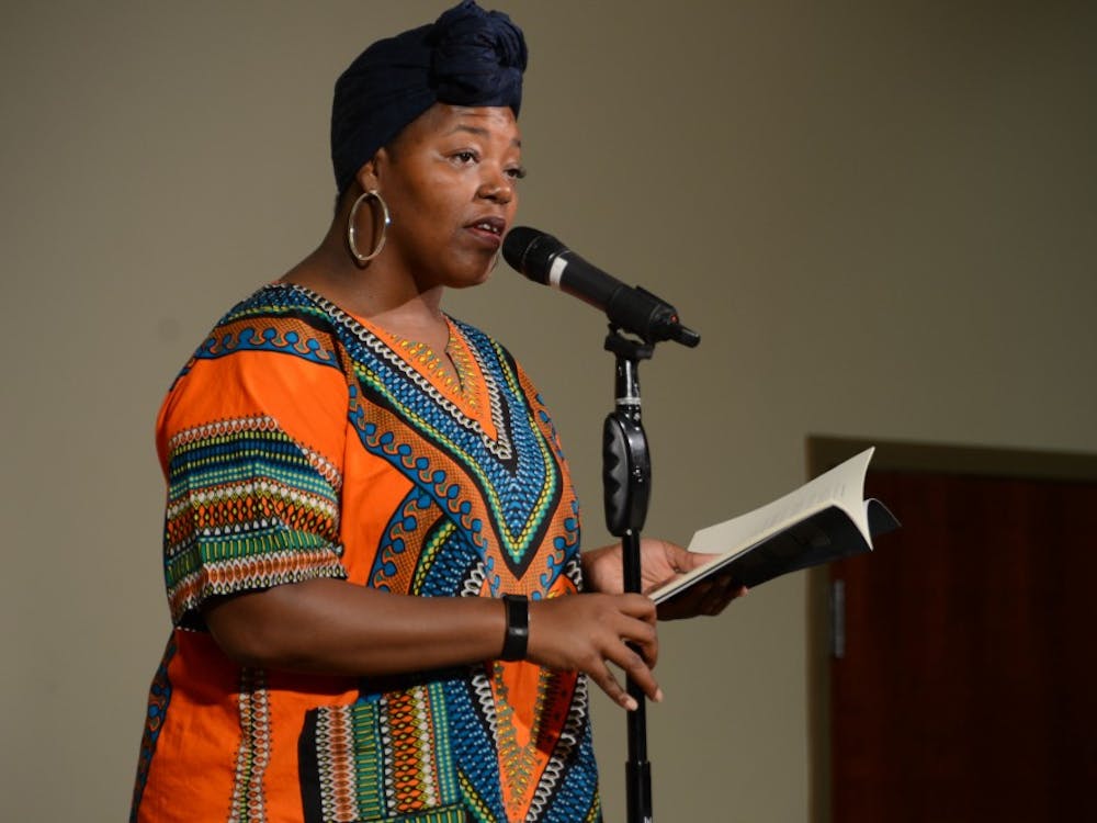 Mahogany Browne, poet and activist, looks to the audience as she reads a piece of work from her book in the L.A. Pittenger Student Center on Sept. 27. Students gathered to listen to Browne and ask questions afterwards, an opportunity that most people will not get. Kaci Alvarez, DN