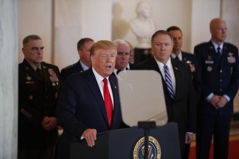 President Donald Trump addresses the nation from the White House on the ballistic missile strike that Iran launched against Iraqi air bases housing U.S. troops, Wednesday, Jan. 8, 2020, in Washington, as Vice President Mike Pence, Secretary of State Mike Pompeo and military leaders, looks on. (AP Photo/Alex Brandon)