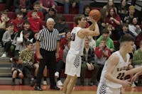 Wapahani junior Isaac Andrews attempts a three-point shot Feb. 2 at Wapahani High School. Andrews finished with seven made three-pointers and 27 points. Zach Carter, DN