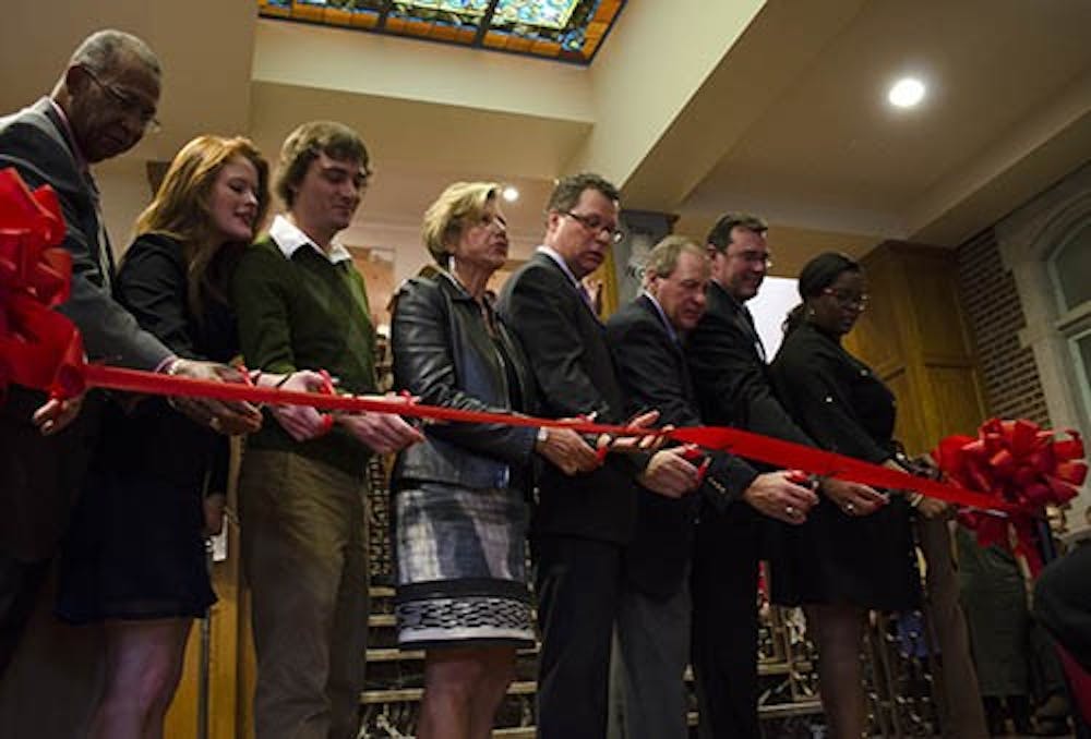 Speakers at the grand reopening of the David Owsley Museum of Art prepare to cut the ribbon to allow the audience to enter. Ball State Alumni Association sponsored the event. DN PHOTO BREANNA DAUGHERTY