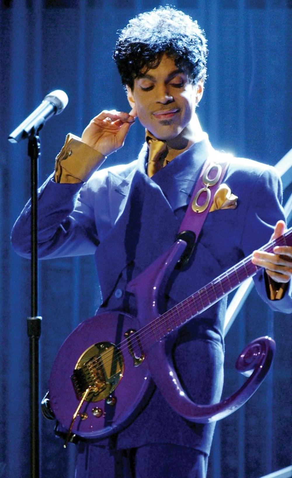 Prince performs &quot;Purple Rain&quot; as the opening act during the 46th Annual Grammy Awards show on Feb. 8, 2004 at the Staples Center in Los Angeles.  Prince died on April 21, 2016. He was 57. (Richard Hartog/Los Angeles Times/TNS) 