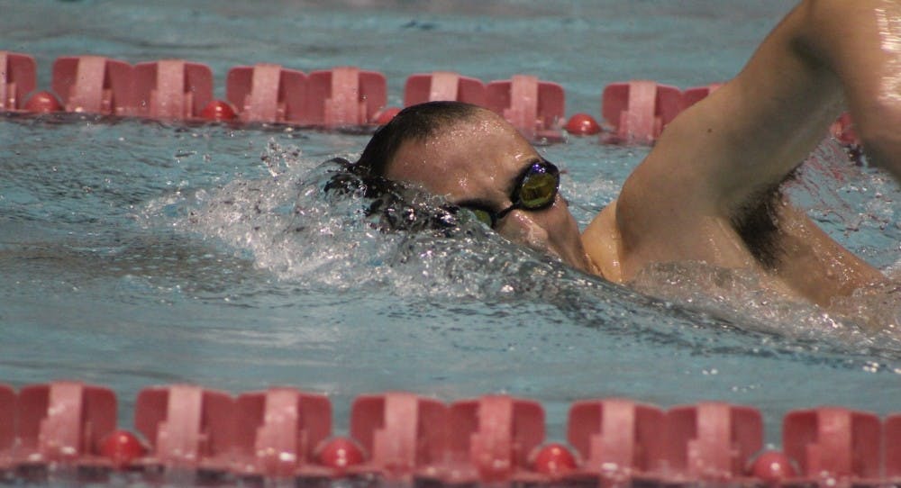 <p>Junior Isaac Walling swims in the 1000 freestyle against Tiffin University on Nov. 5 at Lewellen Aquatic Center. The Ball State men's swim and dive team started the second half of the season losing to IUPUI and Xavier in the dual meet Jan. 6. <em style="background-color: initial;">Patrick Murphy // DN File</em></p>