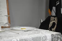 A place setting is held for those who didn't return home March 14 at the American Legion. All members of the legion and auxiliary honor this table: nothing is ever set on it, and the chair is never sat in. Ella Howell, DN