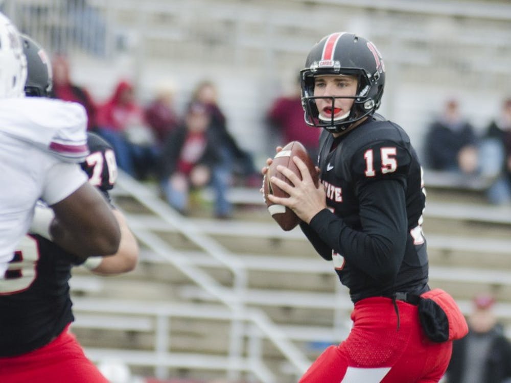 Freshman quarterback Riley Neal looks for an open teammate during the game against the University of Massachusetts on Oct. 31 at Scheumann Stadium. DN PHOTO BREANNA DAUGHERTY