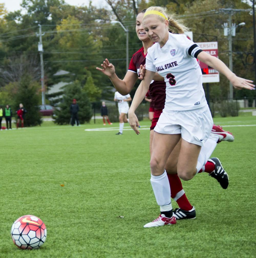 Senior defender Leah Mattingly attempts to block the ball from Northern Illinois University on Oct. 30 at the Briner Sports Complex. The soccer team went on to lose 1-1(4-3) (DN PHOTO Terence K. Lightning Jr.)