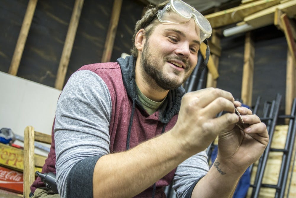 Ball State alumnus Aaron Camino runs a spoon jewelry business called Aaron Paul Designs. He does most of his work in a small shed a few feet from his home in Muncie, Indiana.