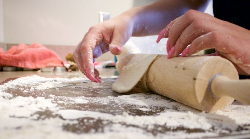 Crystal Pennell rolls out tortillas on a sheet pan March 27 in Kinghorn. Pennell makes tortillas in memory of her grandmother. Rebecca Slezak, DN