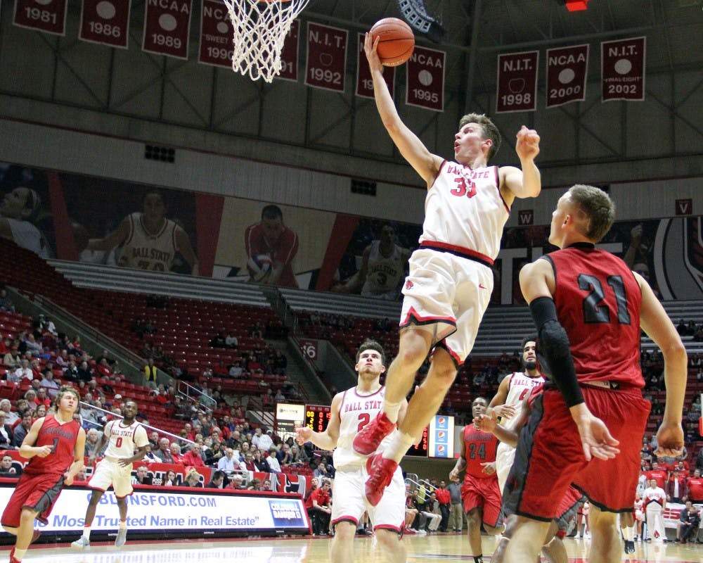 Guard Ryan Weber goes up for a shot during the Cardinals’ game against IU Kokomo on Nov. 29 in Worthen Arena. Ball State won 92 to 52. Paige Grider// DN