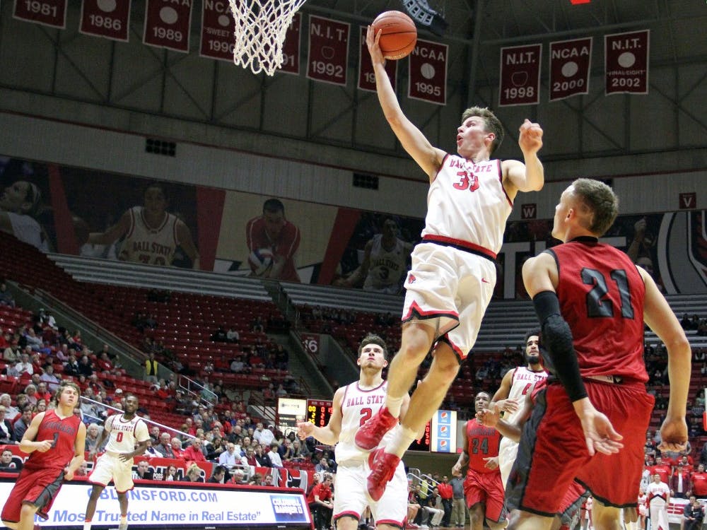 Guard Ryan Weber goes up for a shot during the Cardinals’ game against IU Kokomo on Nov. 29 in Worthen Arena. Ball State won 92 to 52. Paige Grider// DN