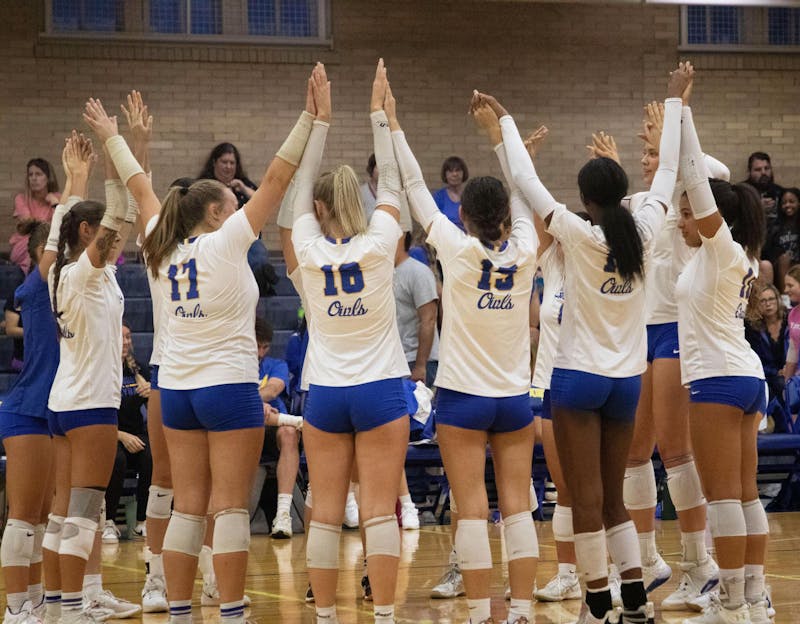 The Burris volleyball team huddles Oct. 3rd before their match against Muncie Central. David Moore, DN
