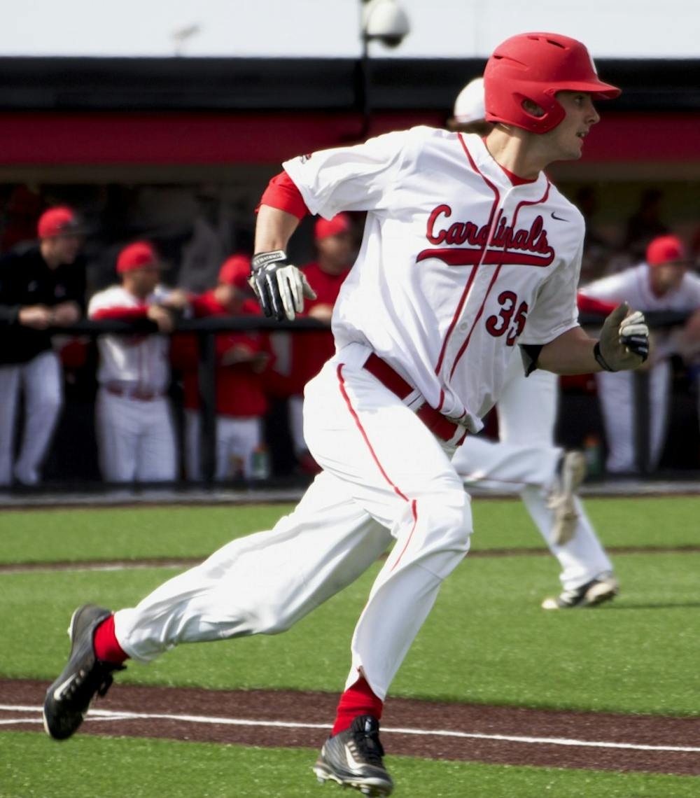 Matt Eppers, a junior outfielder for the Ball State Cardinals, rounds first base in the game against Dayton on March 18. DN PHOTO GRACE RAMEY