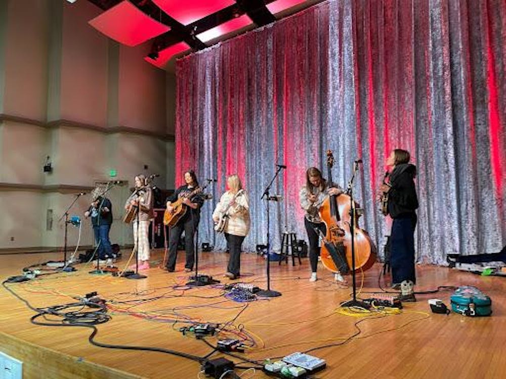 All six members of the band, Sister Sadie, rehearse in Ball State University's Pruis Hall before their performance