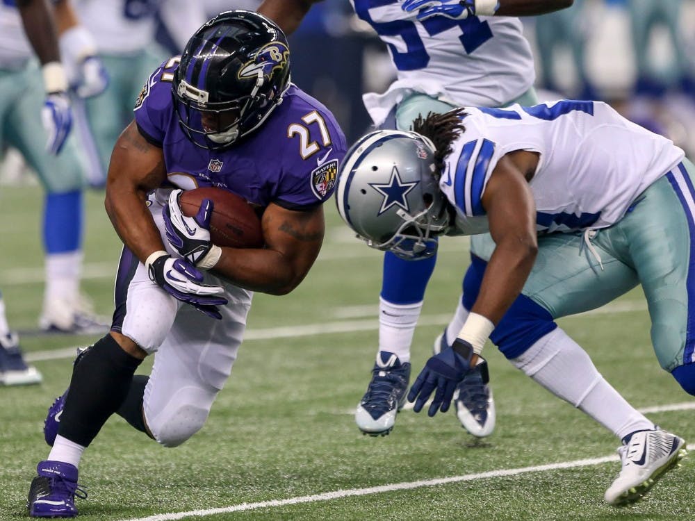 Baltimore Ravens running Ray Rice (27) gets hit by the Dallas Cowboy's J.J Wilcox on a second-quarter carry in preseason action on Saturday, Aug. 16, 2014, at AT&T Stadium in Arlington, Texas. The Ravens won, 37-30. (Steve Nurenberg/Fort Worth Star-Telegram/MCT)