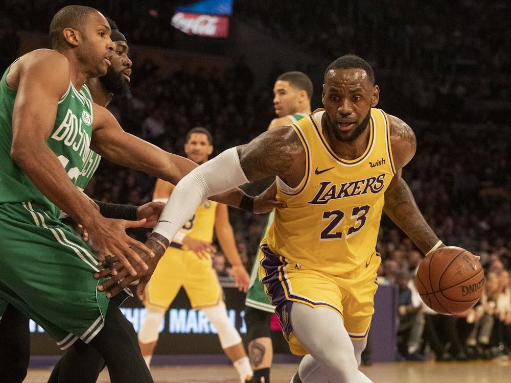 The Los Angeles Lakers' LeBron James (23) drives to the basket as the Boston Celtics' Al Horford defends in the fourth quarter at Staples Center in Los Angeles on Saturday, March 9, 2019. The Celtics won, 120-107. (Brian van der Brug/Los Angeles Times/TNS)