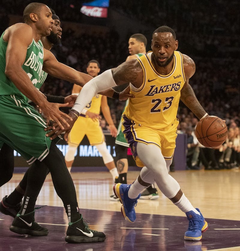 The Los Angeles Lakers' LeBron James (23) drives to the basket as the Boston Celtics' Al Horford defends in the fourth quarter at Staples Center in Los Angeles on Saturday, March 9, 2019. The Celtics won, 120-107. (Brian van der Brug/Los Angeles Times/TNS)