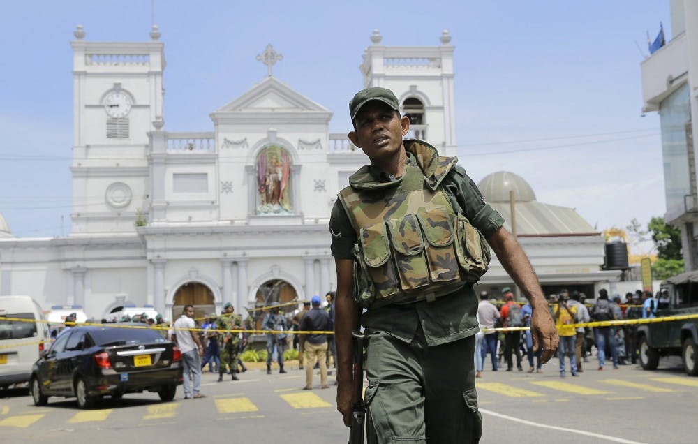 Sri Lankan Army soldiers secure the area around St. Anthony's Shrine after a blast in Colombo, Sri Lanka, Sunday, April 21, 2019. More than two hundred people were killed and hundreds more injured in eight blasts that rocked churches and hotels in and just outside Sri Lanka's capital on Easter Sunday. (AP Photo/Eranga Jayawardena)