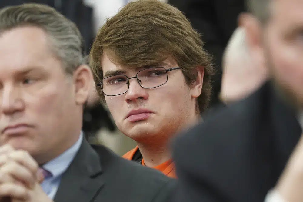 Payton Gendron sheds tears as he listens to impact statements during his sentencing for charges including murder and domestic terrorism motivated by hate in an Erie County court room in Buffalo, N.Y., on Wednesday, Feb 15, 2023. Gendron, a white supremacist who killed 10 Black people at a Buffalo supermarket was sentenced to life in prison without parole. (Derek Gee/The Buffalo News via AP, Pool)