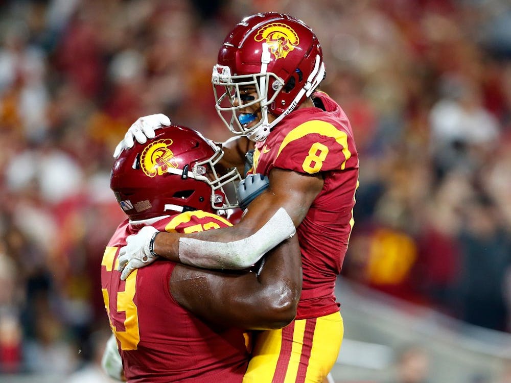 USC wide receiver Amon-Ra St. Brown (8) is congratulated by teammate Drew Richmond after scoring a touchdwon against Stanford in the second quarter at the Los Angeles Memorial Coliseum on Saturday, Sept. 7, 2019. (Luis Sinco/Los Angeles Times/TNS)