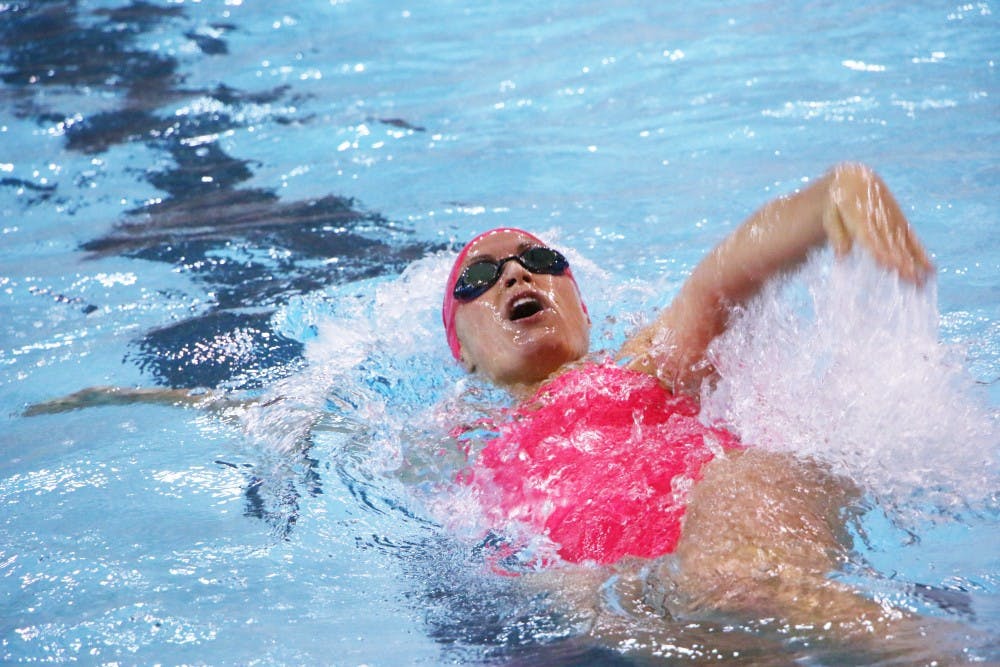 Genevieve Hayes swims the backstroke during the 200-yard backstroke at the swim meet against Ohio University on Oct. 26 at Lewellen Aquatic Center. The swimming and diving team will take on Michigan State Nov. 1 in East Lansing, Mich. DN PHOTO TAYLOR IRBY