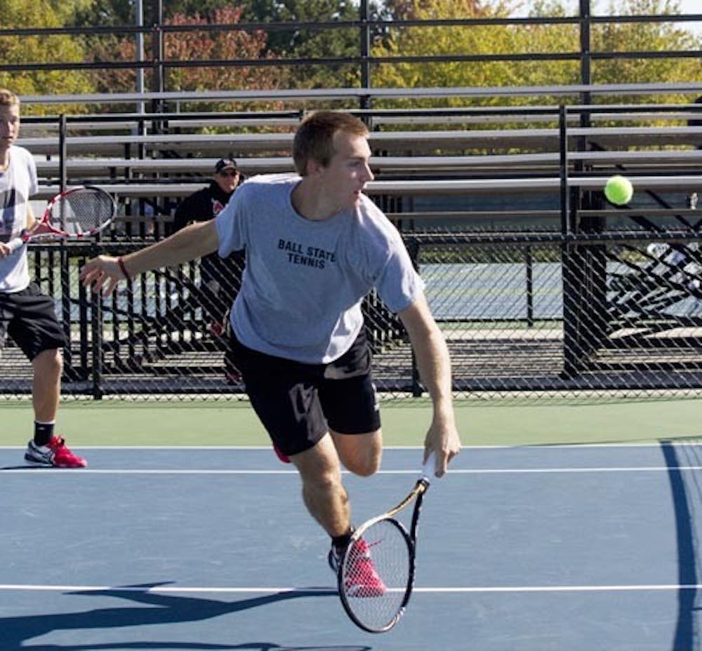 Dalton Albertin covers the net during the Ball State Fall Invitational on Sep. 28, 2012. The men’s tennis team took a loss against North Western Sunday, only taking one of their matches. DN FILE PHOTO EMMA FLYNN