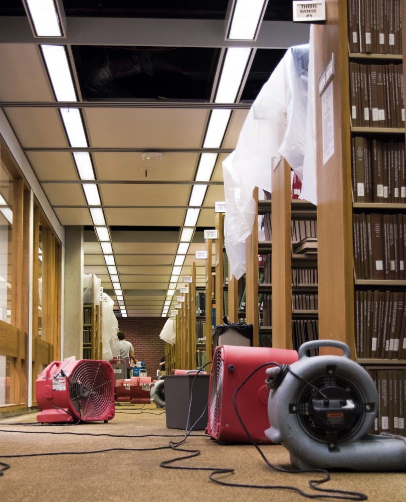 On the west side of the fourth floor in the Bracken Library about 50 fans are spread out around after a pipe broke on April 16 on the fifth floor. DN PHOTO STEPHANIE AMADOR