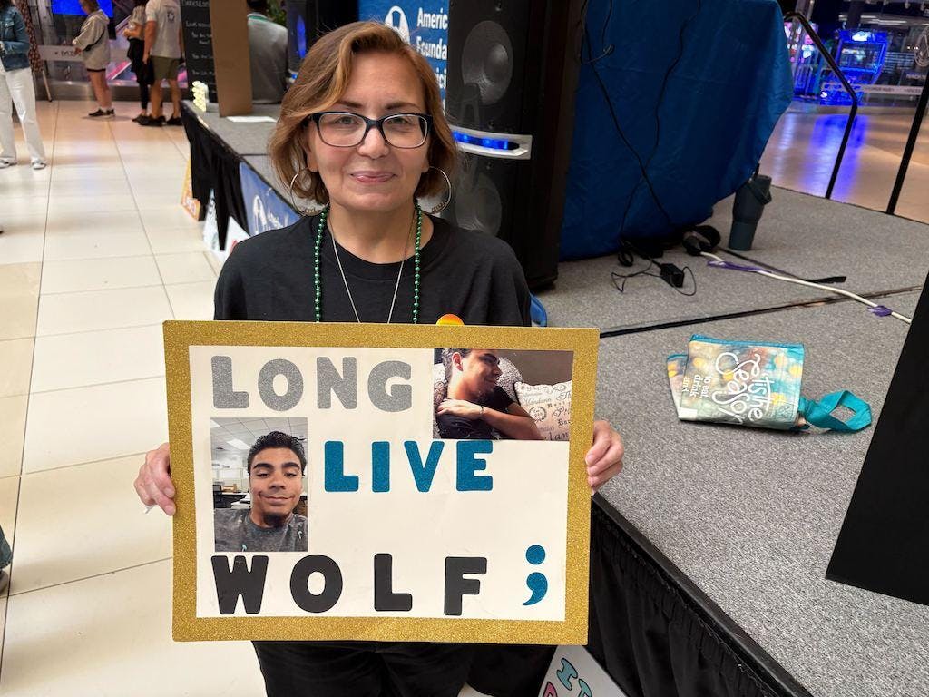 Jessie Edmond holds a photo of her son, Julian “Wolf” Rivera, who died at 27 in 2019 in Middletown, N.Y. Suicide has increased for Gen Z adults ages18-27 since 2014, when the millennials were in early adulthood, with most of the increase among Black and Hispanic men. (Photo by Tim Henderson/Stateline)