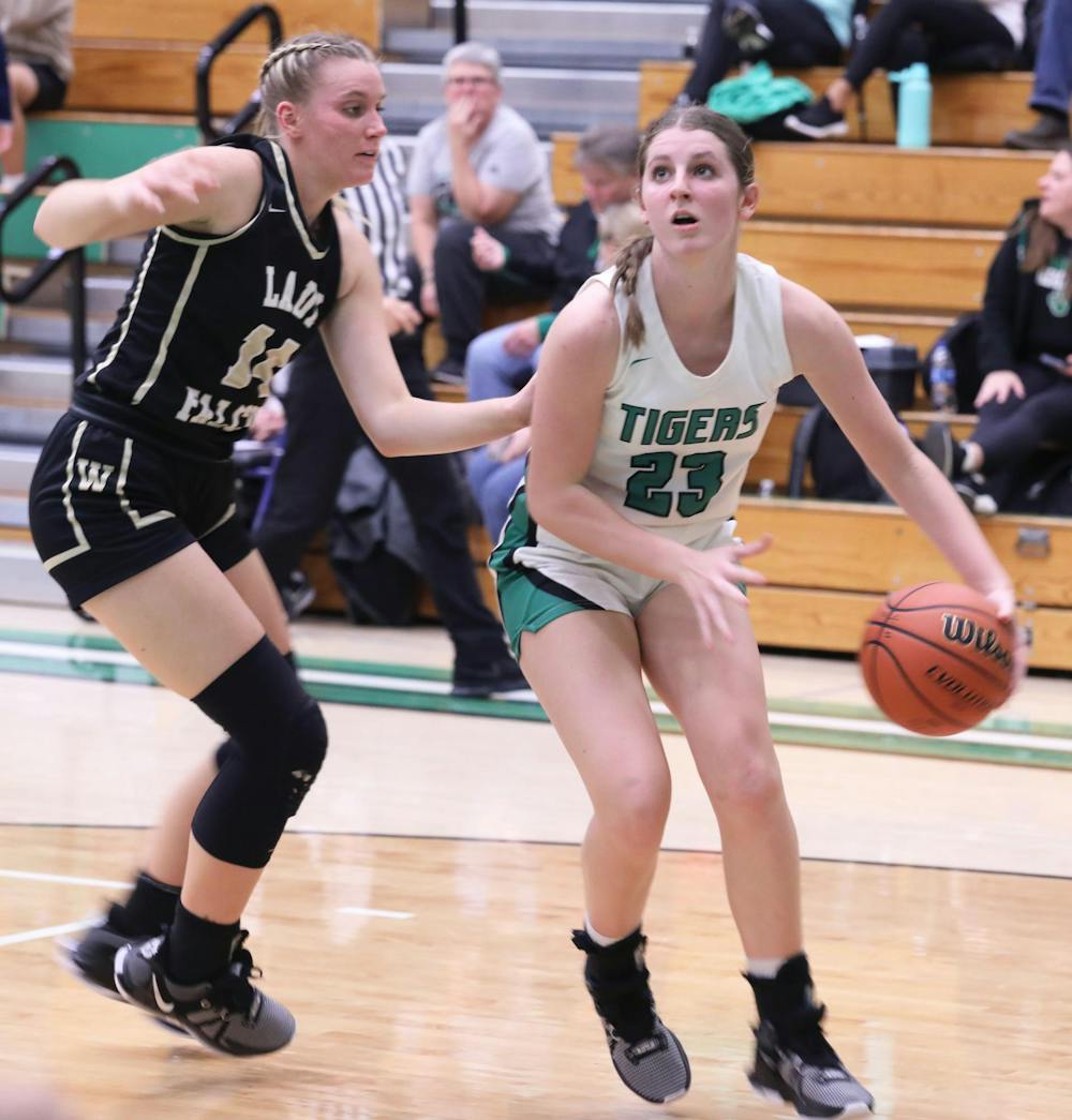 <p>Sophomore Lilly Sylvester dribbles Nov. 14, 2023 in a game against Winchester at Yorktown High School. David Moore, DN</p>