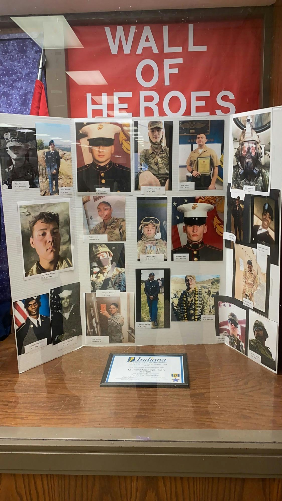 Muncie Central High School&#x27;s (MCHS) &quot;Wall of Heroes&quot; display, depicting former students who went onto serve in the military. MCHS was designated a Purple Star school in 2021 by the Indiana Department of Education for its programs and services honoring veterans and their families. Richard Kann, DN