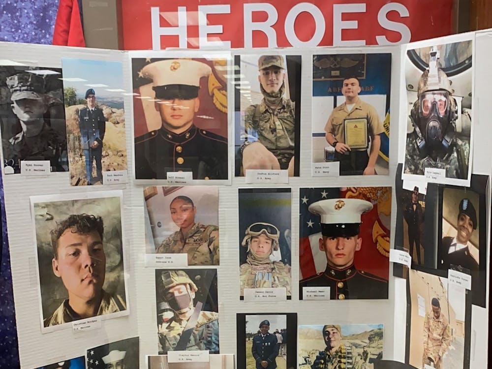 Muncie Central High School&#x27;s (MCHS) &quot;Wall of Heroes&quot; display, depicting former students who went onto serve in the military. MCHS was designated a Purple Star school in 2021 by the Indiana Department of Education for its programs and services honoring veterans and their families. Richard Kann, DN