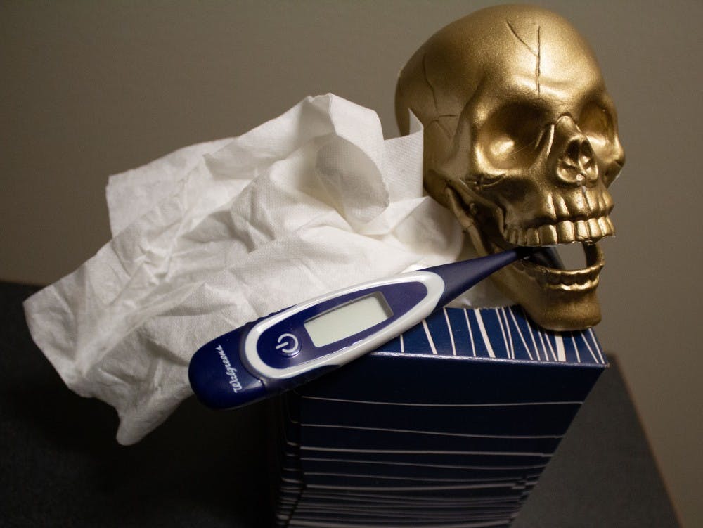 A photo illustration representing the sickness that could spread among students upon entering flu season. Students can get their flu shot at the Health Center to help prevent getting ill. Sydney McWhinney,DN