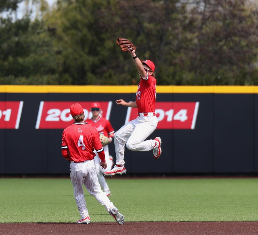<p>Junior infielder Nick Husovsky jumps to catch a ball hit by Ohio March 30 at First Merchants Ballpark Complex. The Cardinals won 14-7 against the Bobcats. Mya Cataline, DN</p>