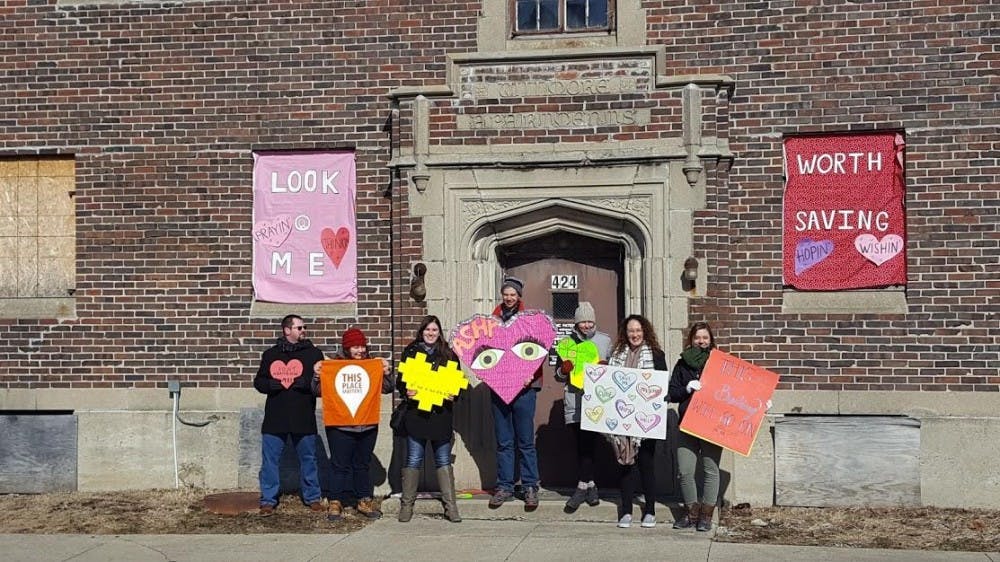 Heart Bombers decorated the former Wilmore Apartments at&nbsp;424 W. Main Street on Saturday, Feb. 10 in downtown Muncie. The goal of Heart Bombing is to decorate historical buildings in the area to bring attention to its significance. Evan Weaver, DN
