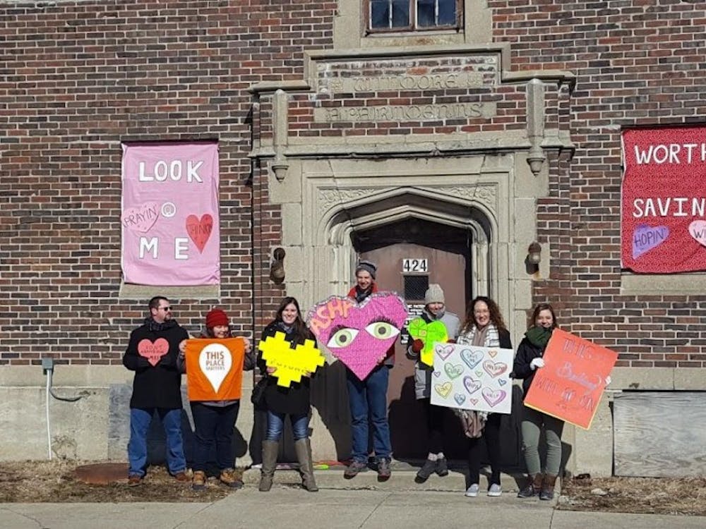 Heart Bombers decorated the former Wilmore Apartments at&nbsp;424 W. Main Street on Saturday, Feb. 10 in downtown Muncie. The goal of Heart Bombing is to decorate historical buildings in the area to bring attention to its significance. Evan Weaver, DN
