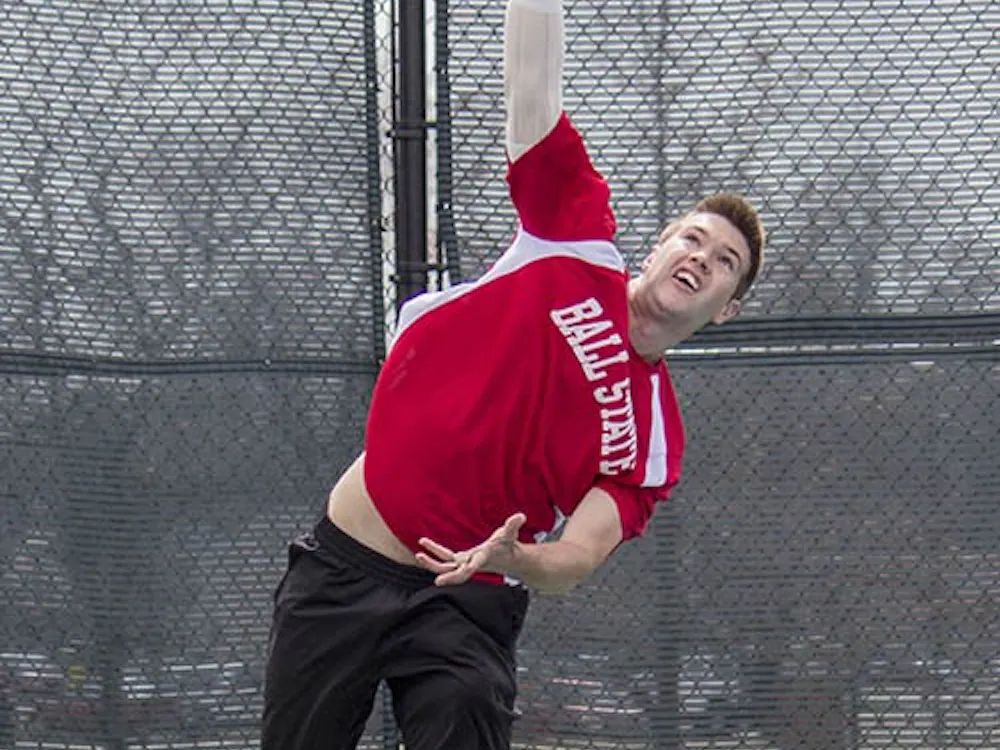 Senior Cliff Morrison serves against Northern Illinois on Apr. 6. DN PHOTO ANDREW KELLY