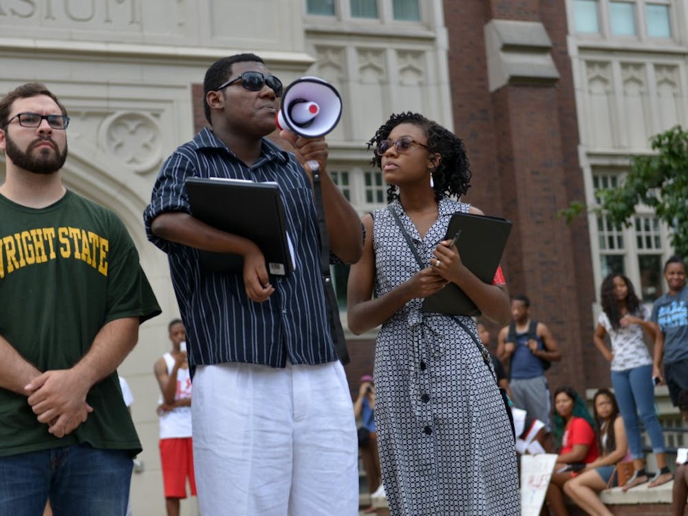 Student Nathaniel Thomas as the organizer of the protest is giving the opening speech on Sunday afternoon on North Quad. DN PHOTO SICONG XING