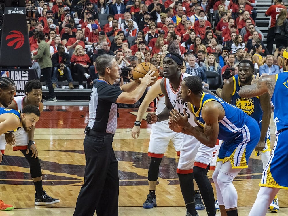 Toronto Raptors forward Pascal Siakam prepares for tip-off against Golden State Warriors forward Andre Iguodola during Game 2 of the 2019 NBA Finals June 2, 2019. The Warriors appeared in five consecutive NBA Finals from 2015 to 2019, earning three championships. Chensiyuan, Photo Courtesy 